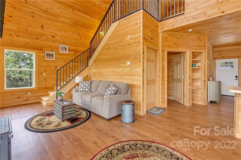 1299 Fox Rdg Trail Marion, NC 28752 - Photo 9 of 23 a view of a dining room with furniture wooden floor and a rug