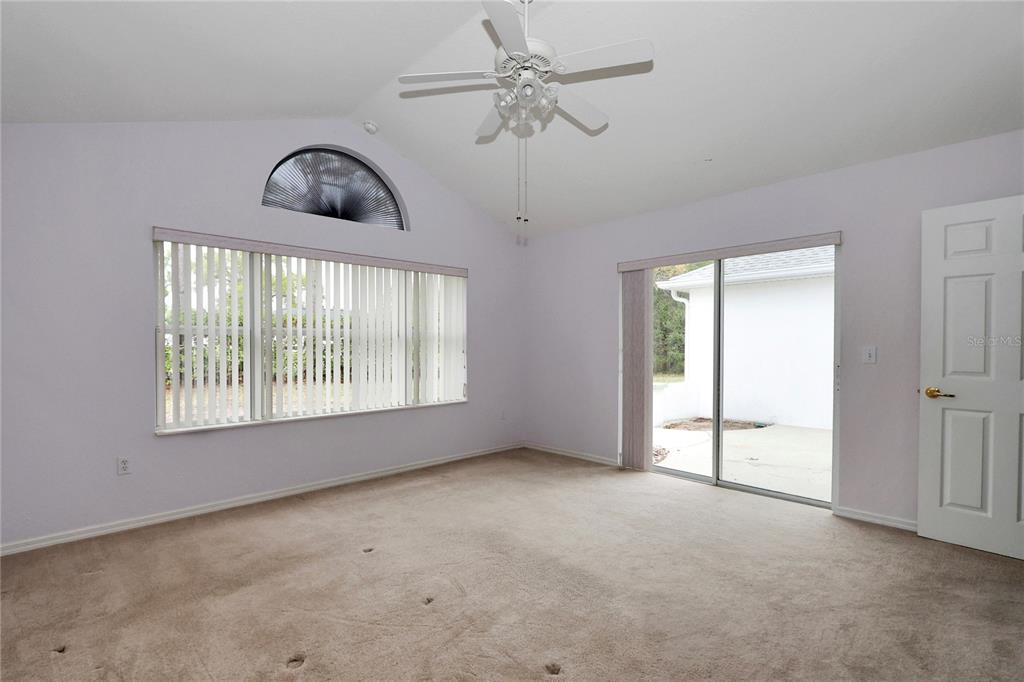 6318 Southwest 117th Loop Ocala, FL 34476 - Photo 11 of 60 a view of an empty room with a window