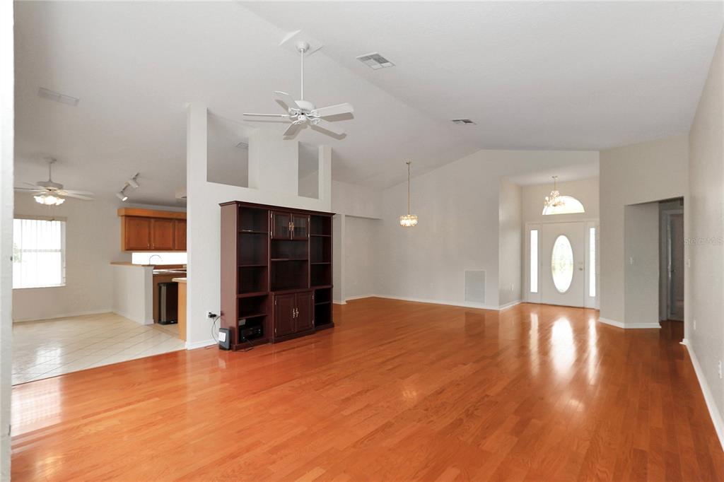 6318 Southwest 117th Loop Ocala, FL 34476 - Photo 16 of 60 a view of an empty room with a bathroom and a fireplace