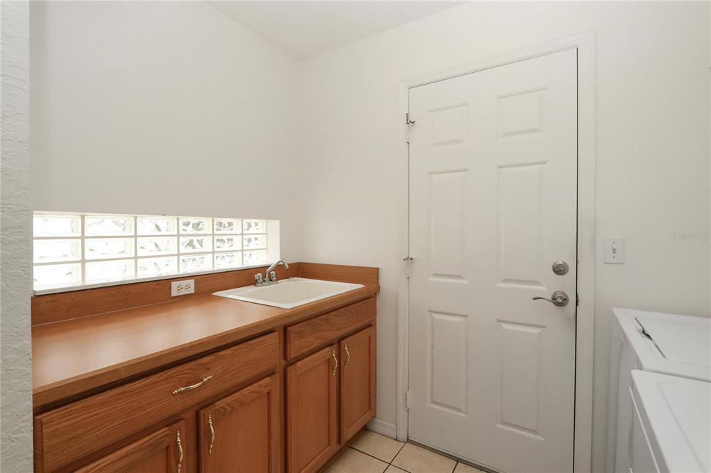 6318 Southwest 117th Loop Ocala, FL 34476 - Photo 31 of 60 a view of a bathroom with a sink and a vanity