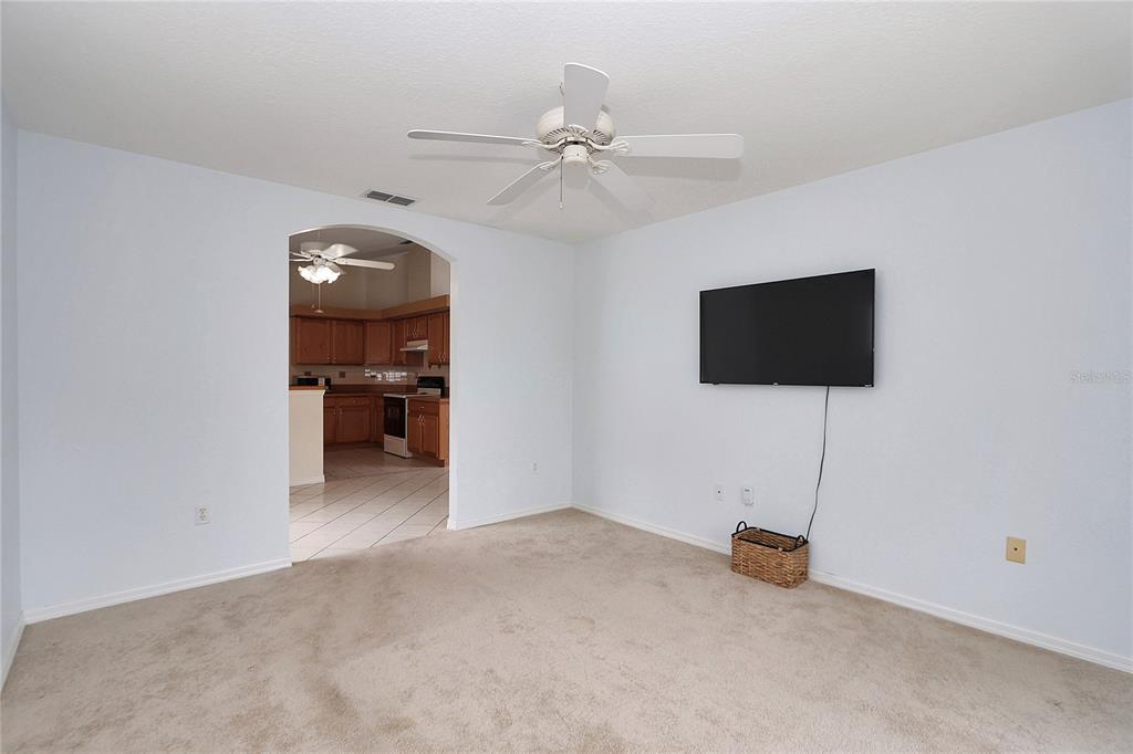 6318 Southwest 117th Loop Ocala, FL 34476 - Photo 34 of 60 a view of a livingroom with a furniture and a ceiling fan