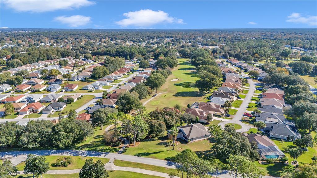 6318 Southwest 117th Loop Ocala, FL 34476 - Photo 45 of 60 an aerial view of residential houses with outdoor space and trees