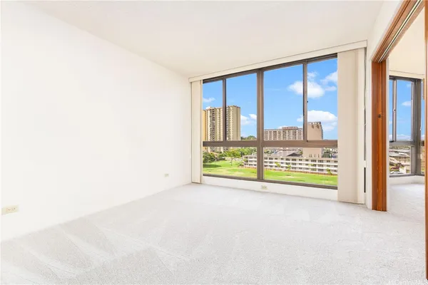 a view of an empty room with a window