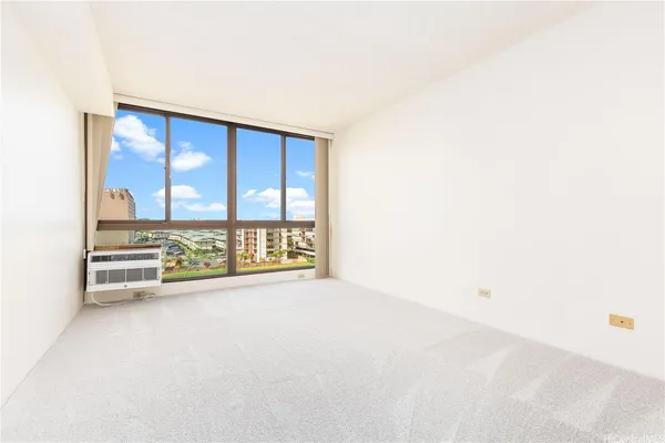 a view of an empty room with a window