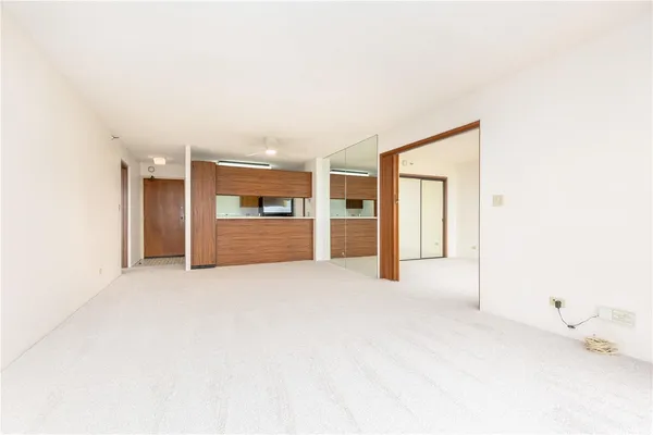 a view of an empty room with a window