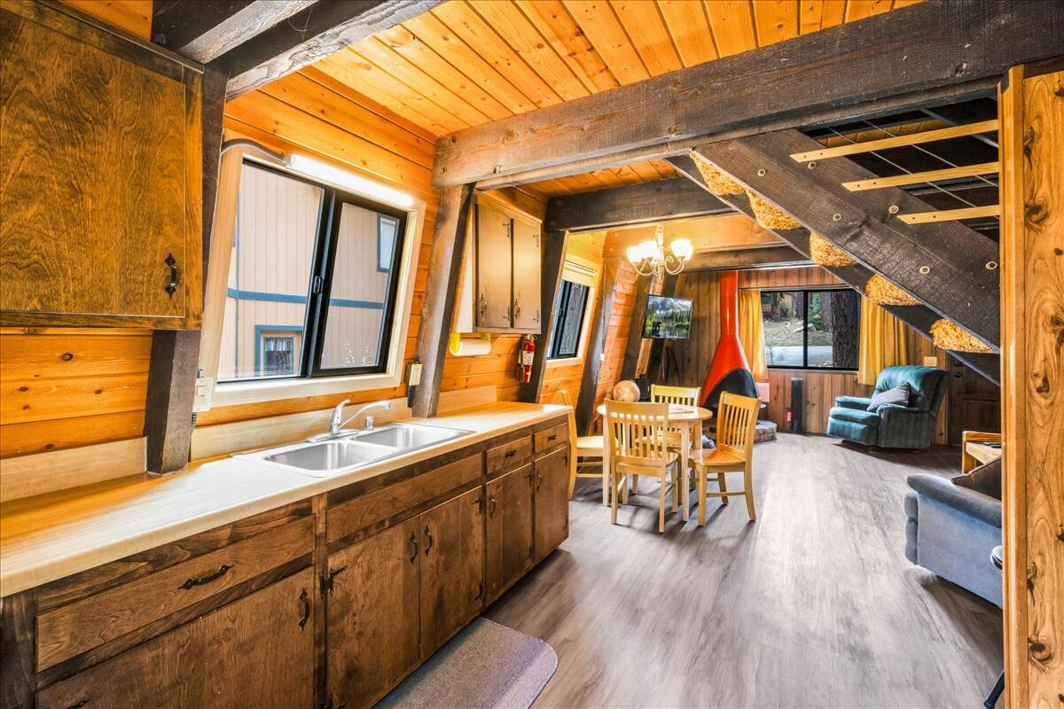 39656 Forest Road Big Bear Lake, CA 92315 - Photo 13 of 40 a very nice looking room with wooden floor and furniture