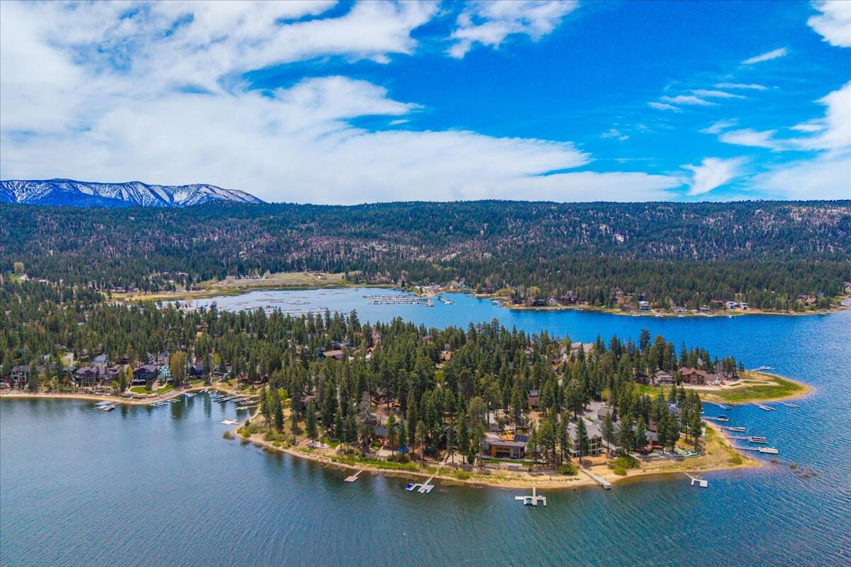 39656 Forest Road Big Bear Lake, CA 92315 - Photo 39 of 40 a view of a lake with a mountain in the background