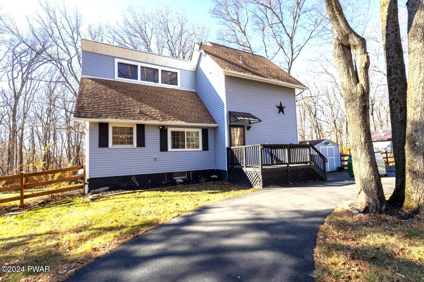 137 Stonehenge Road Milford, PA 18337 - Photo 2 of 30 a view of a house with a yard covered with snow in the outdoor space