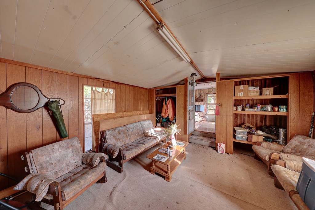 438-1 Yellowstone Lane Hunt, TX 78024 - Photo 40 of 44 a living room with furniture a rug and a large window