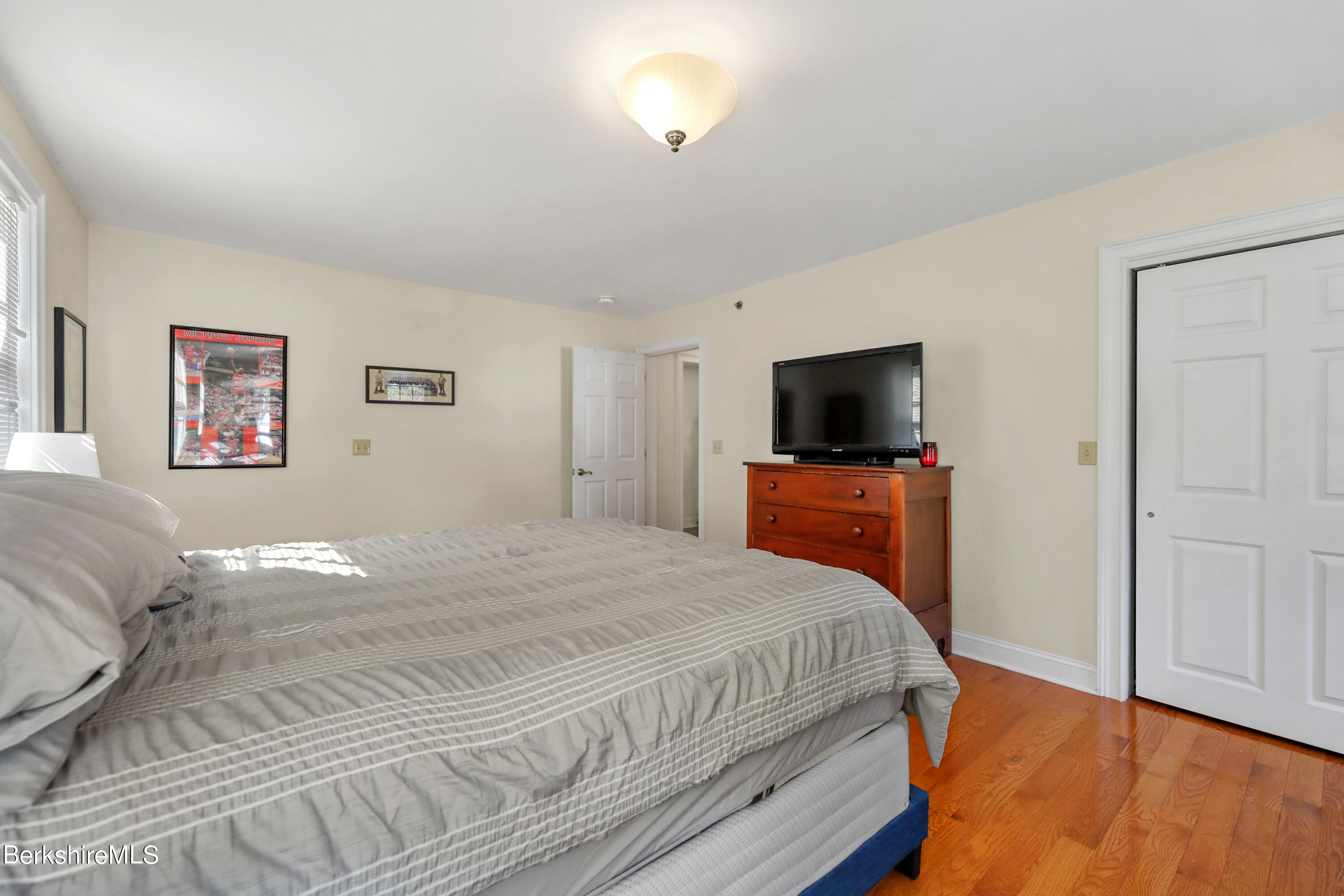 29 Main Street West Stockbridge, MA 01266 - Photo 43 of 51 a bedroom with a bed and a flat screen tv