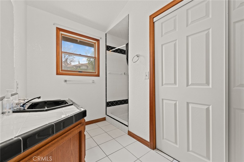 17033 Andromeda Lane Riverside, CA 92504 - Photo 40 of 57 His full bathroom with closet