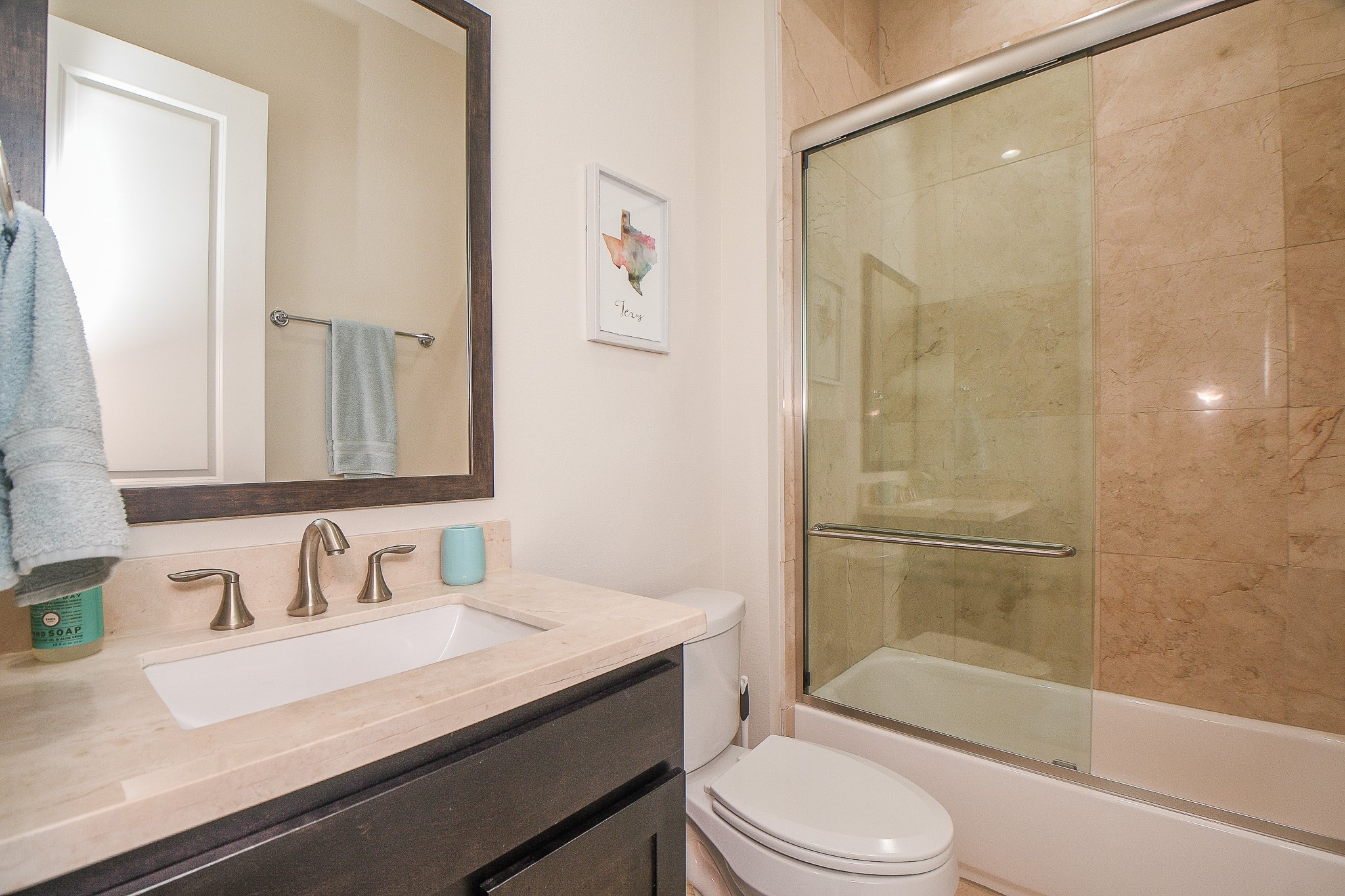1204 Fowler Street Houston, TX 77007 - Photo 20 of 23 a bathroom with a granite countertop sink toilet and shower