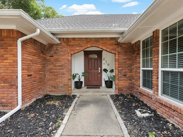 a front view of a house with a area