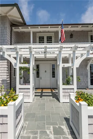a view of a white house with a large window