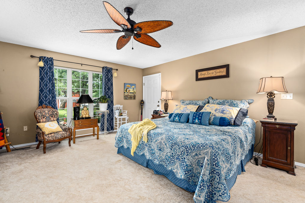 365 Calihan Road Booneville, AR 72927 - Photo 40 of 59 Carpeted room featuring a ceiling fan, a window with exterior views, and neutral-toned walls