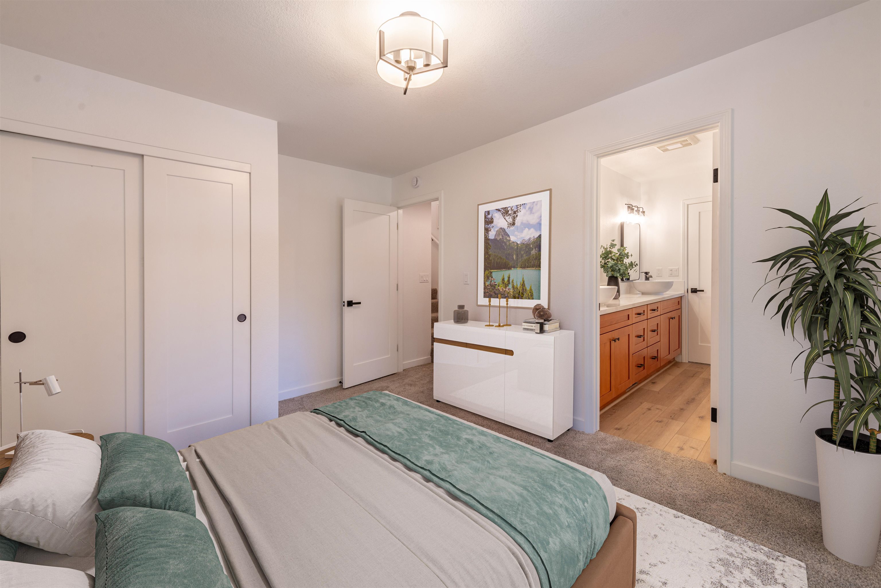12839 Palisade Street Truckee, CA 96161 - Photo 17 of 21 a bedroom with a bed and a potted plant