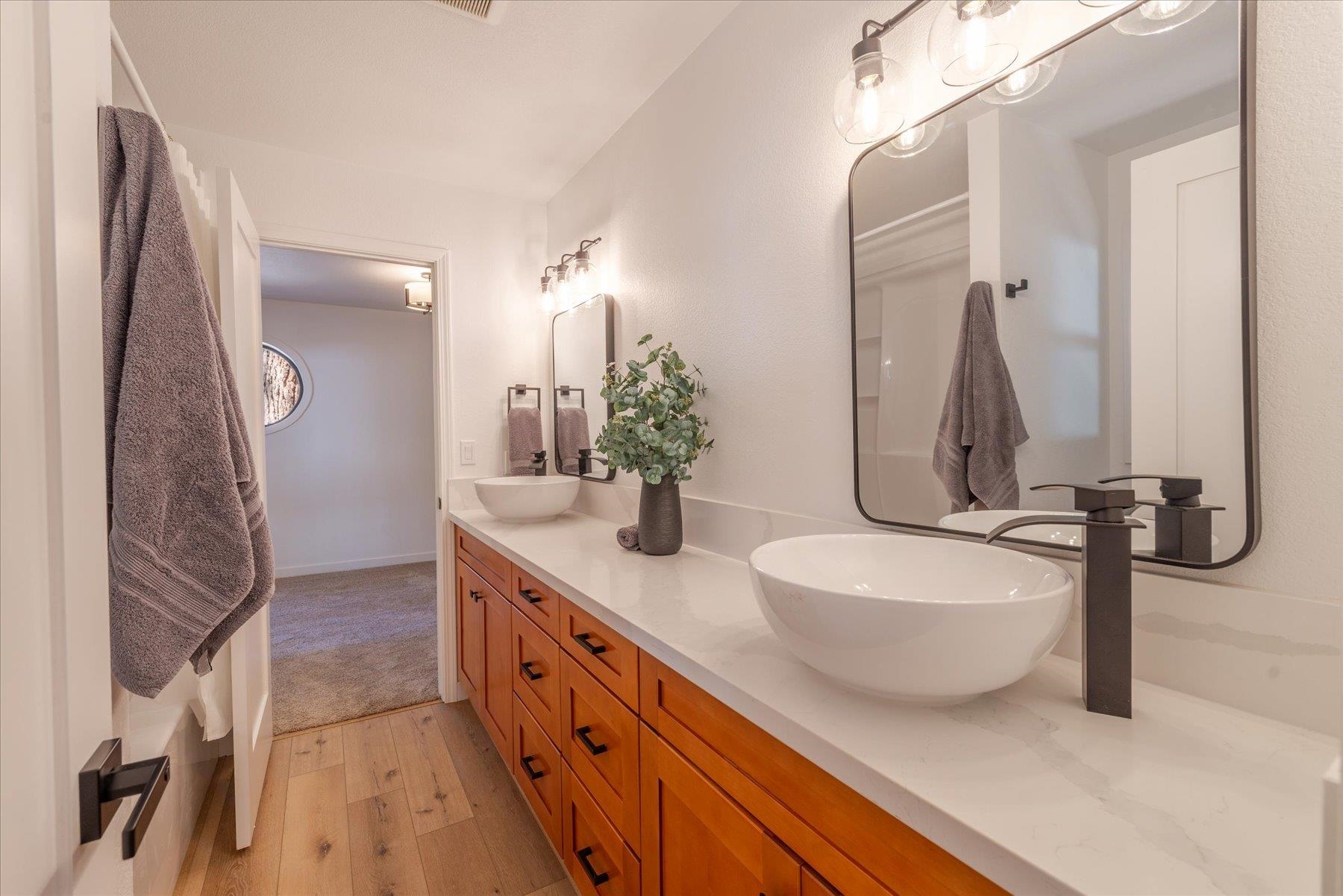 12839 Palisade Street Truckee, CA 96161 - Photo 18 of 21 a bathroom with a double vanity sink and a mirror