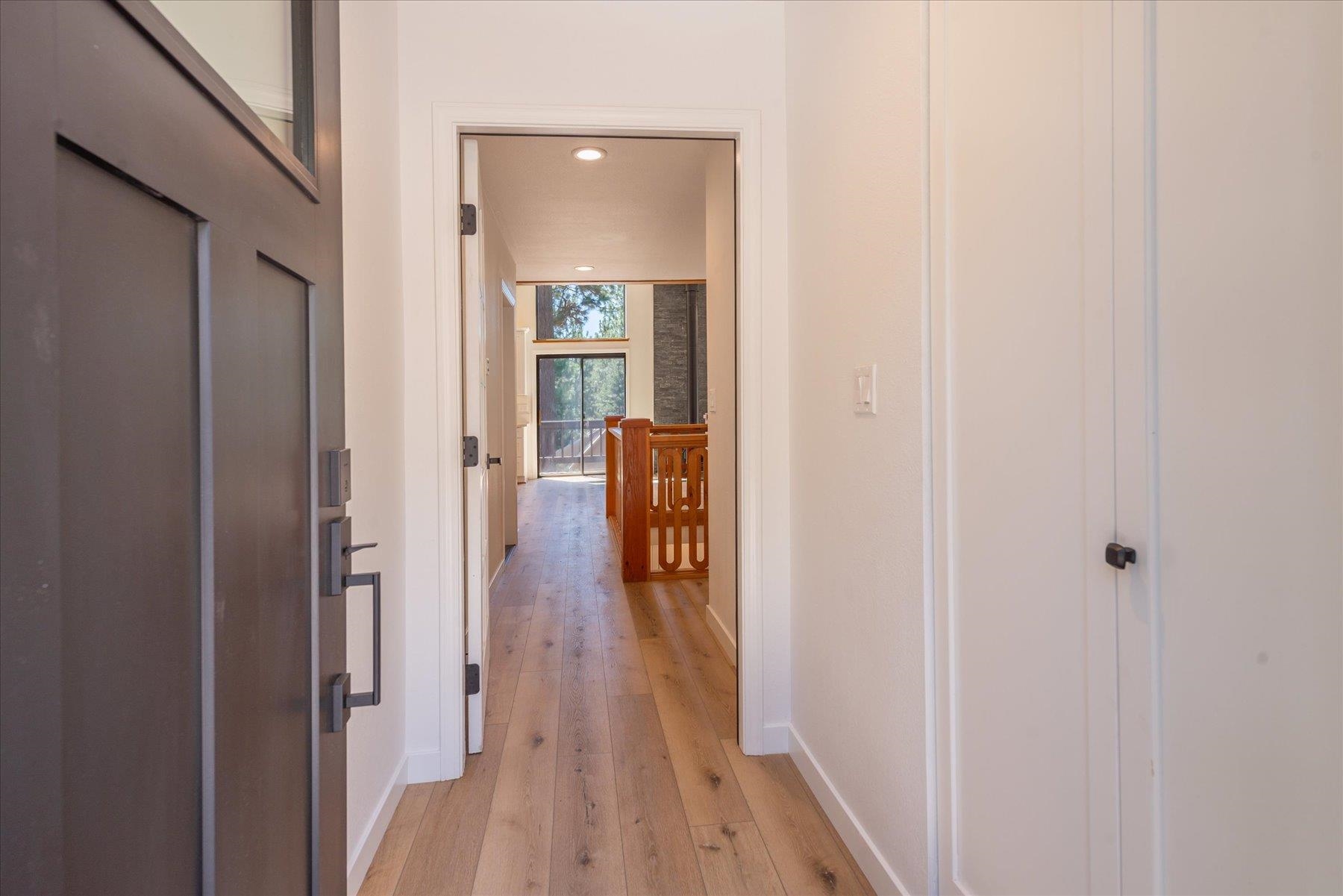 12839 Palisade Street Truckee, CA 96161 - Photo 20 of 21 a hall way with wooden floor and stairs
