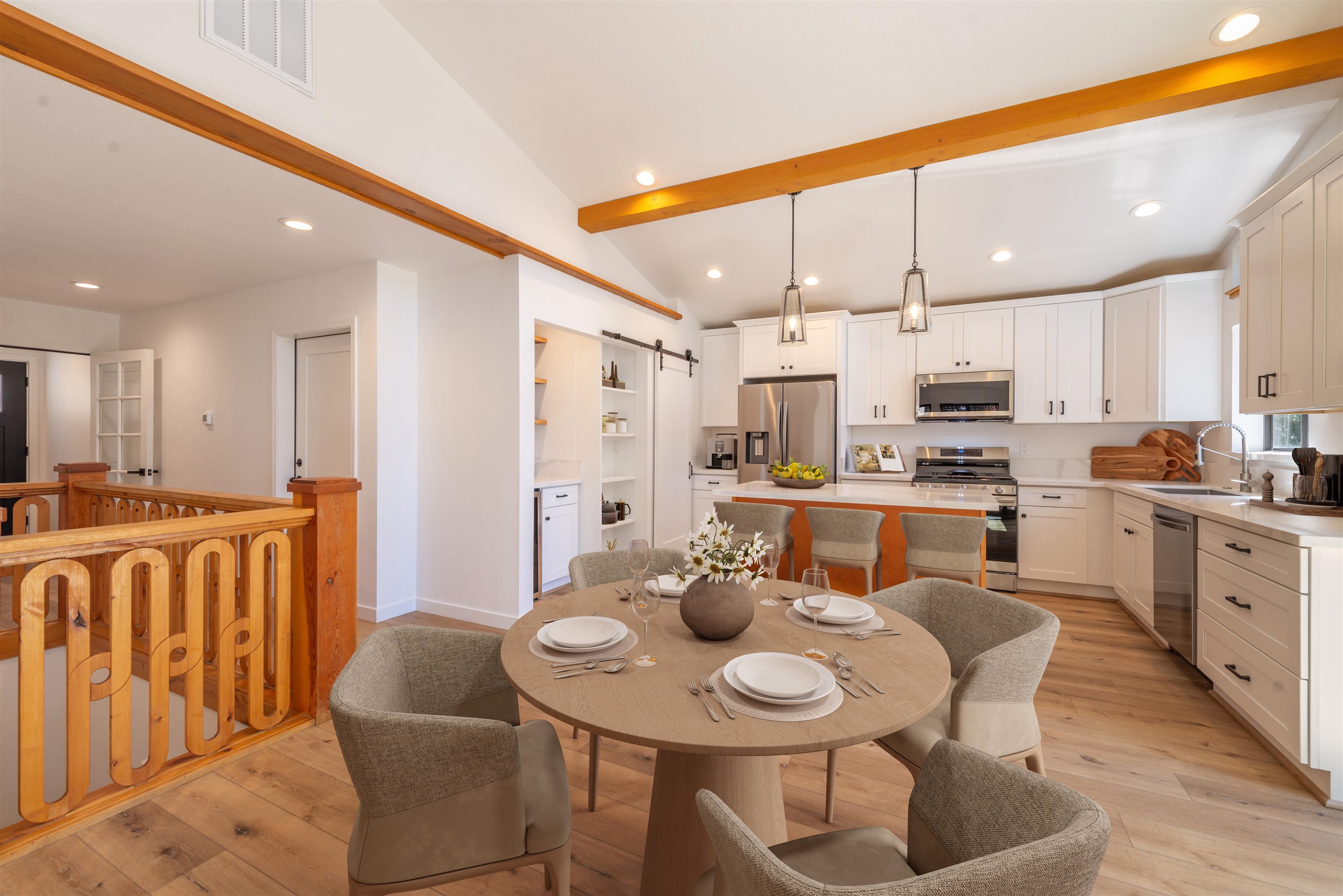 12839 Palisade Street Truckee, CA 96161 - Photo 4 of 21 a kitchen with stainless steel appliances kitchen island granite countertop a dining table chairs and view kitchen