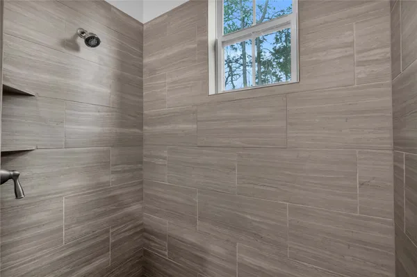 a bathroom with a sink vanity granite and a mirror