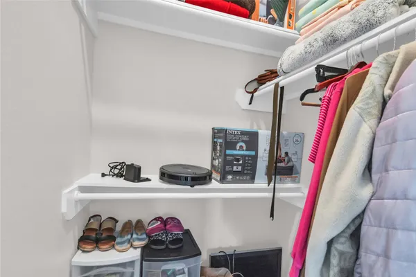 a bathroom with a toilet a sink a mirror a bathtub and shower