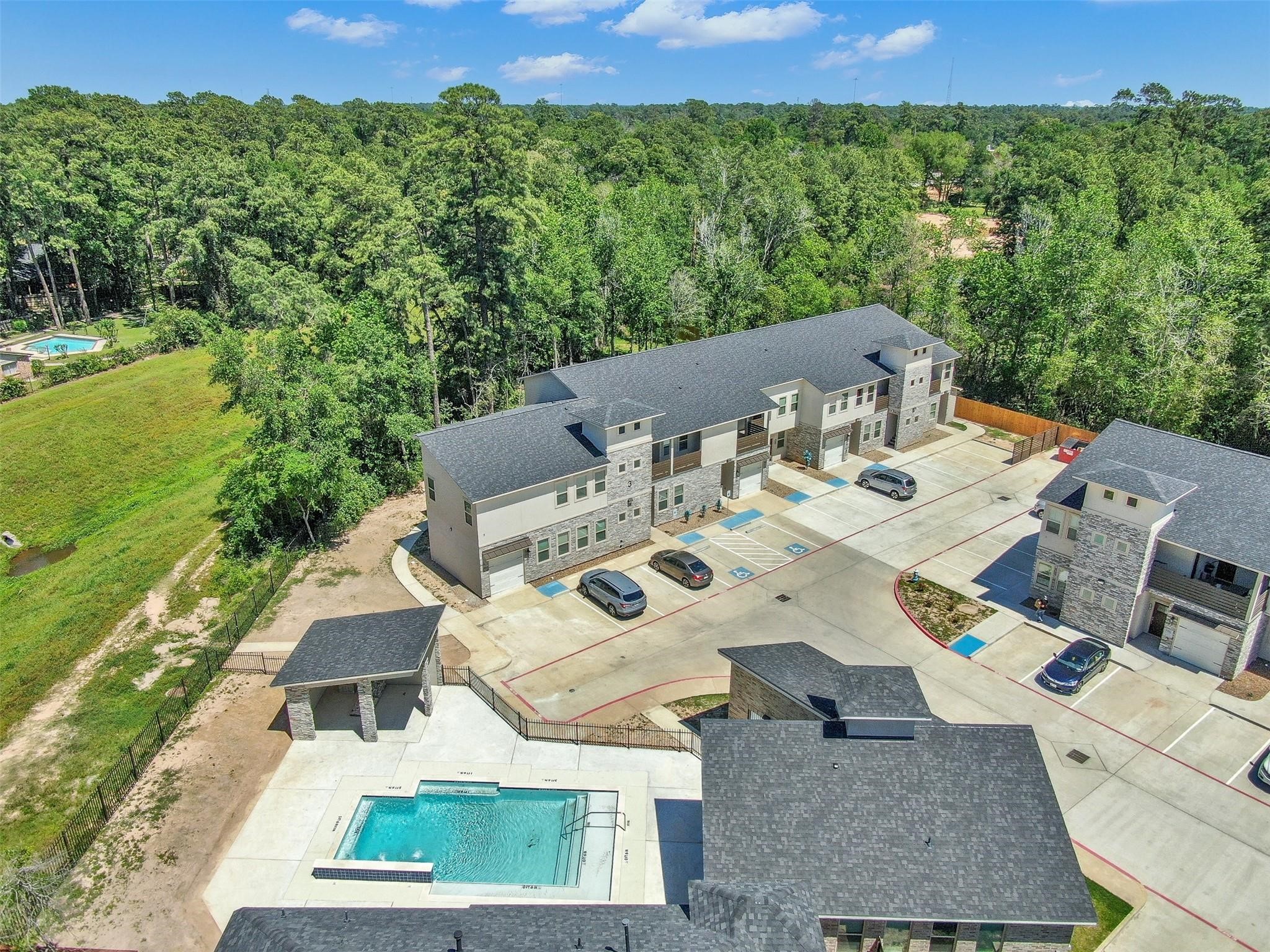 504 Nursery Road, Unit 2210 Spring, TX 77380 - Photo 29 of 38 Pool area includes covered pavilion with a BBQ Grill and Gym.