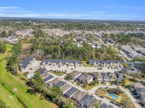 an aerial view of residential building with parking space
