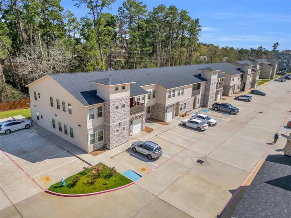 an aerial view of a house with outdoor space
