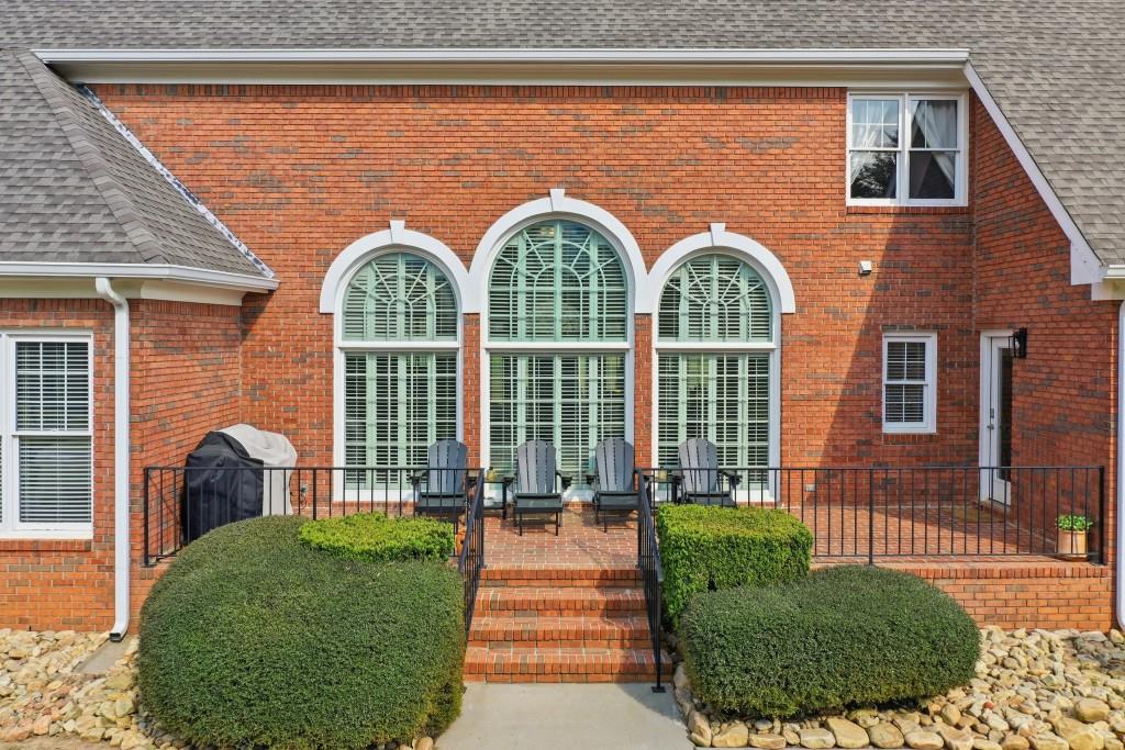 398 South 6th St Extension Milner, GA 30257 - Photo 15 of 30 a front view of a house with a garden