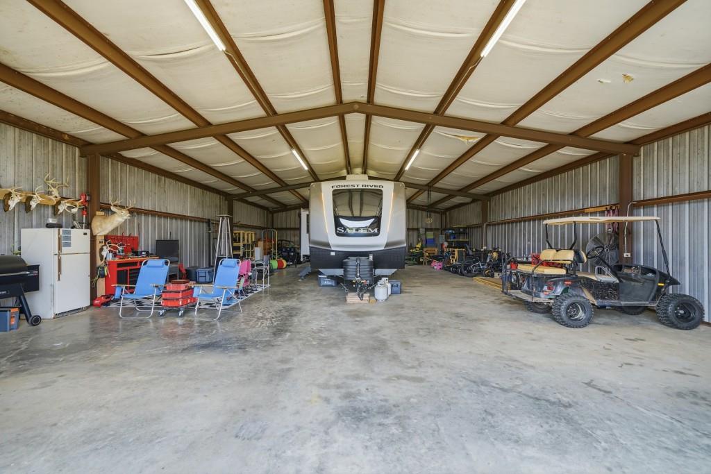 398 South 6th St Extension Milner, GA 30257 - Photo 18 of 30 a view of parking garage with cars