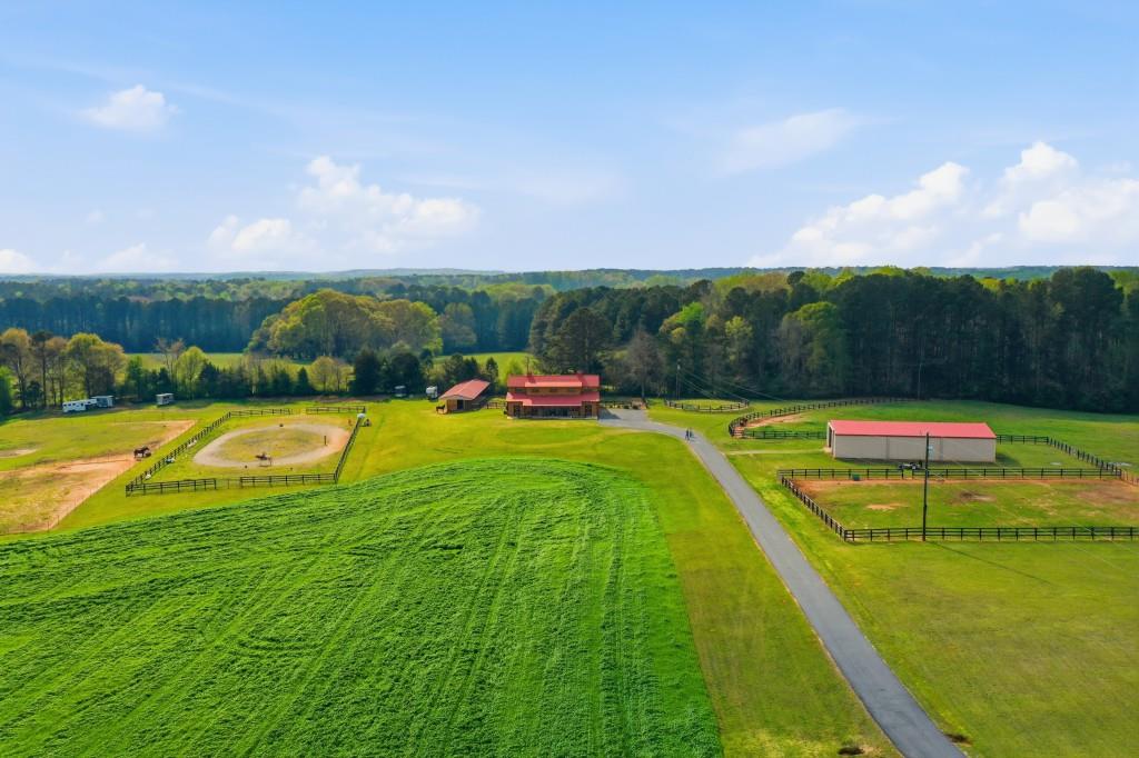 398 South 6th St Extension Milner, GA 30257 - Photo 2 of 30 a view of a swimming pool with a yard and a tub