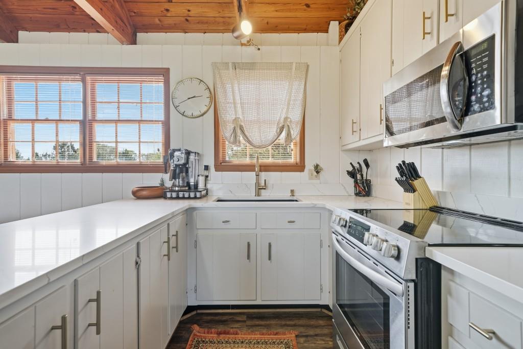 398 South 6th St Extension Milner, GA 30257 - Photo 21 of 30 a kitchen with a sink cabinets and window