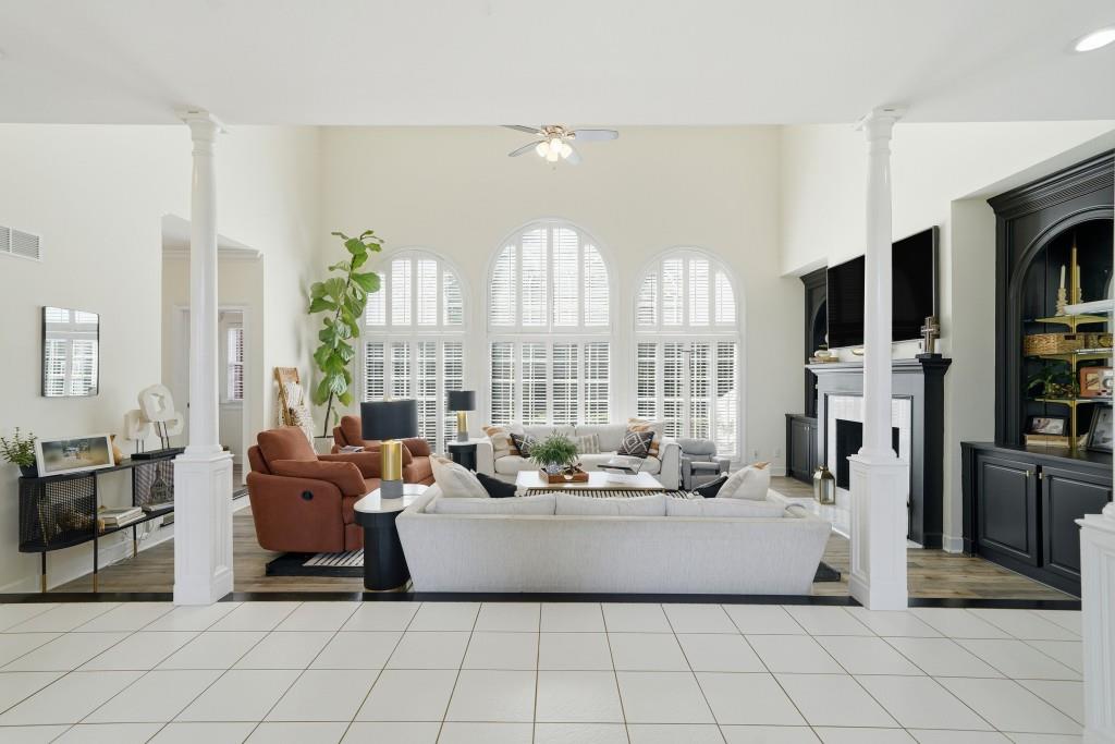 398 South 6th St Extension Milner, GA 30257 - Photo 4 of 30 a living room with furniture and a flat screen tv