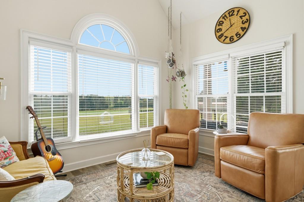398 South 6th St Extension Milner, GA 30257 - Photo 8 of 30 a living room with furniture and a large window