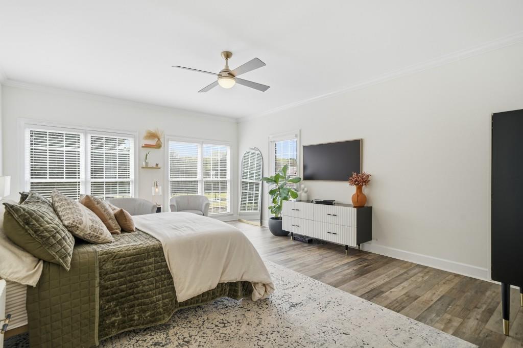 398 South 6th St Extension Milner, GA 30257 - Photo 10 of 30 a bedroom with a bed and large window