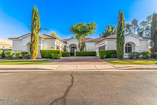 a view of house with a yard