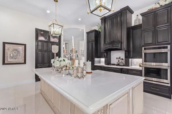 a kitchen with stainless steel appliances a sink stove and refrigerator
