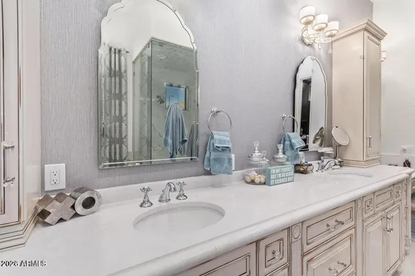a bathroom with a double vanity sink and a mirror