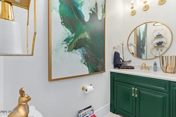 a living room with furniture a rug and a bookshelf