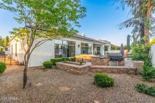 a view of a backyard with sitting area