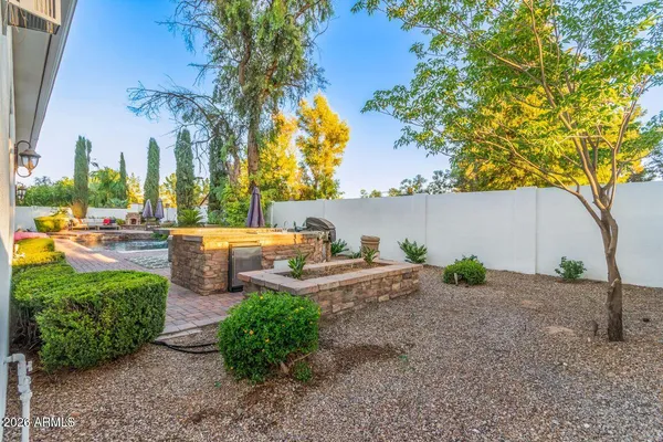 a view of a swimming pool with chairs