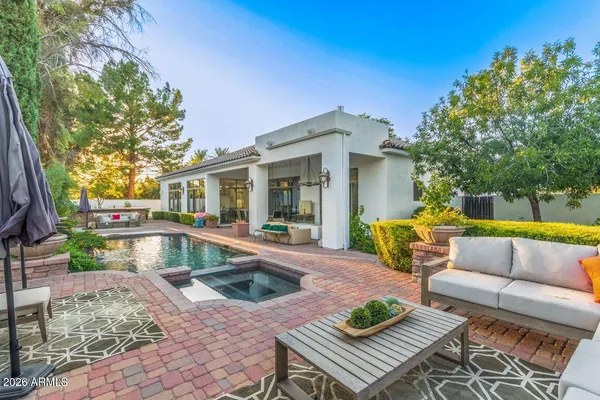 a view of a swimming pool with a patio