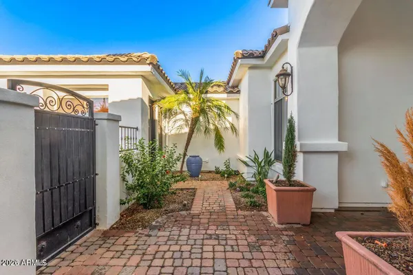 a potted plant sitting in front of a house