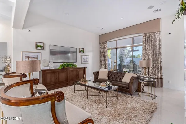 a living room with furniture and a window