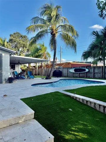 a view of yard with patio