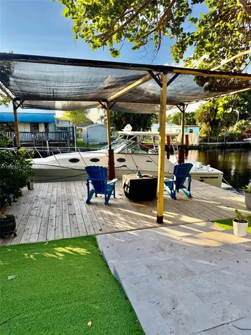 a view of swimming pool with a patio
