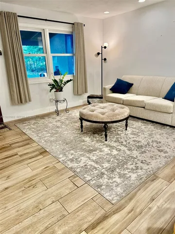 a living room with a couch and a table