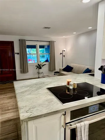 a kitchen with a stove and a sink
