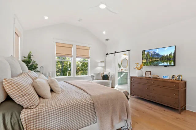 a view of a backyard with wooden fence