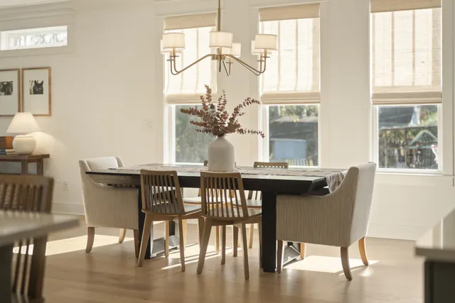 a dining room with furniture and window